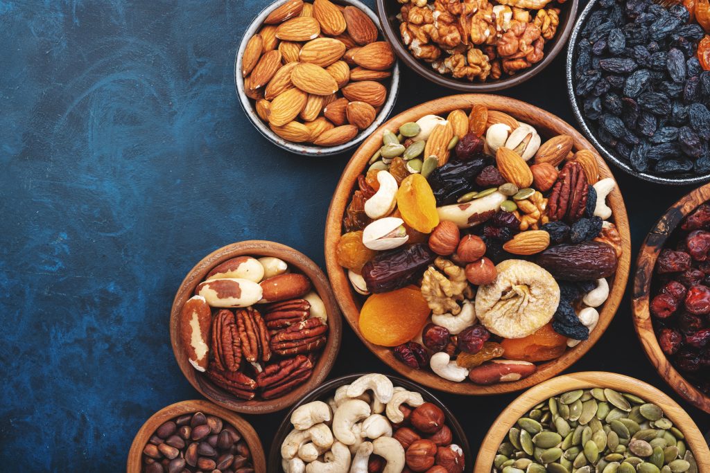 Nuts and dried fruits in assortment. Dry apricots, figs, raisins, walnuts, almonds